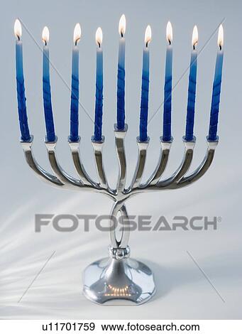 Close up of menorah with lit candles View Large Photo Image Stock Photo - Close up of menorah with lit candles. Fotosearch