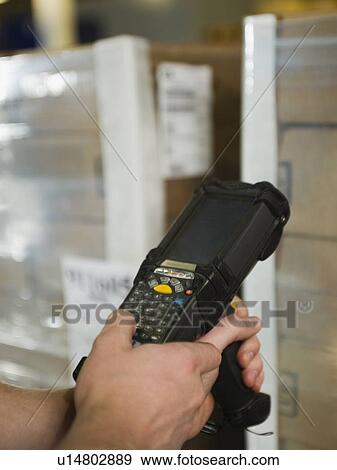 Stock Photo - Close up of package scanner. Fotosearch