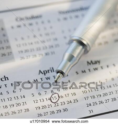 Picture - Close up of pen and calendar. Fotosearch