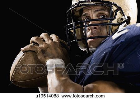 Close up of quarterback preparing to throw football View Large Photo Image Stock Photo - Close up of quarterback preparing to throw football. Fotosearch