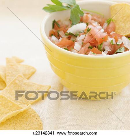 Close up of salsa and tortilla chips View Large Photo Image Stock Image - Close up of salsa and tortilla chips. Fotosearch
