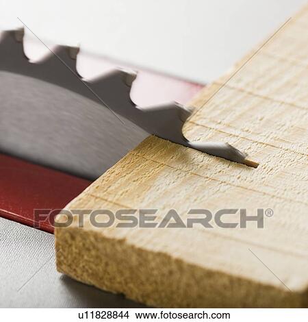 Picture - Close up of saw cutting wood. Fotosearch