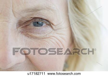 Stock Image - Close up of senior woman’s eye. Fotosearch