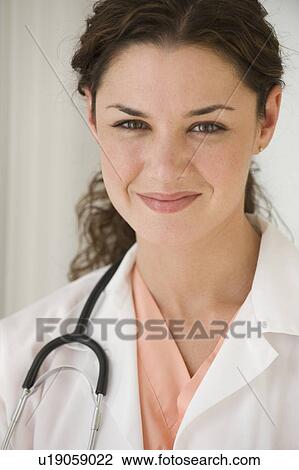 Close up of smiling female doctor View Large Photo Image Stock Image - Close up of smiling female doctor. Fotosearch