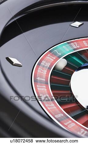 Close up of spinning roulette table View Large Photo Image Stock Photo - Close up of spinning roulette table. Fotosearch