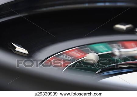 Stock Photo - Close up of spinning roulette table. Fotosearch