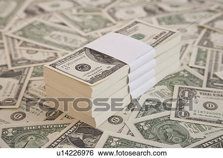 Stock Photograph - Close up of stack of money. Fotosearch