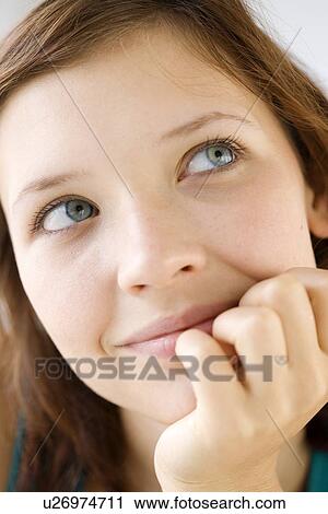 Close up of teenage girl daydreaming View Large Photo Image Stock Image - Close up of teenage girl daydreaming. Fotosearch