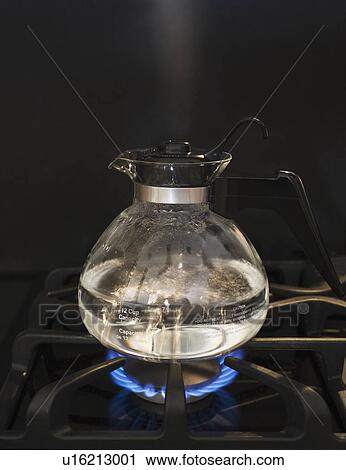 Close up of water boiling on stove View Large Photo Image Stock Image - Close up of water boiling on stove. Fotosearch