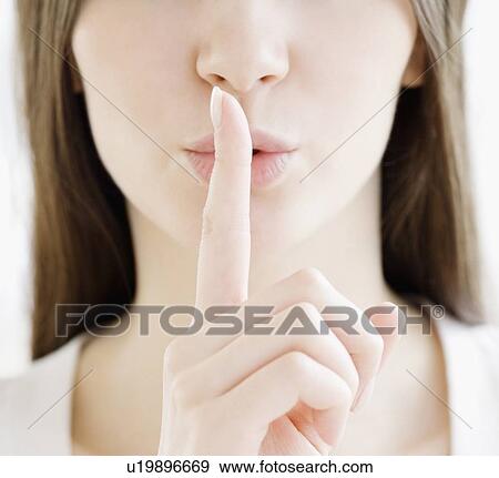 Stock Photo - Close up of woman shushing. Fotosearch