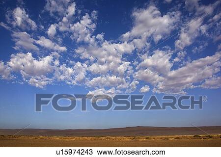 Clouds in blue sky, Namib Desert, Namibia, Africa View Large Photo Image Stock Image - Clouds in blue sky, Namib Desert, Namibia, Africa. Fotosearch