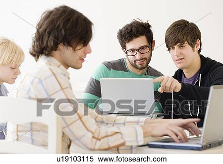 Stock Photography - College students with laptops in classroom. Fotosearch