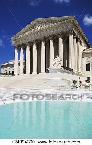 Stock Image - Columned building and reflecting pool, Washington DC, United States. Fotosearch