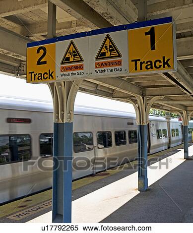 Commuter train arriving at station platform View Large Photo Image Stock Photography - Commuter train arriving at station platform. Fotosearch