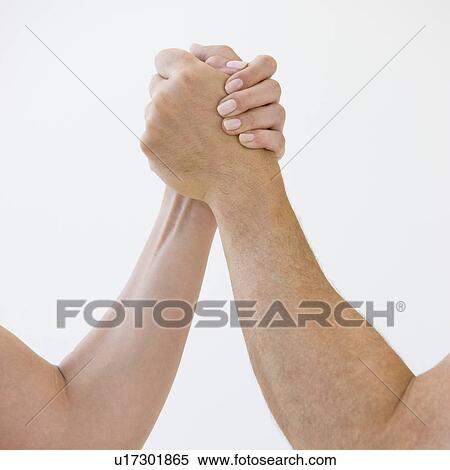 Stock Photography - Couple arm wrestling. Fotosearch