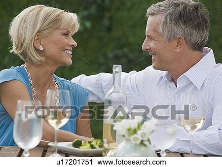 Couple enjoying wine outdoors View Large Photo Image Stock Image - Couple enjoying wine outdoors. Fotosearch