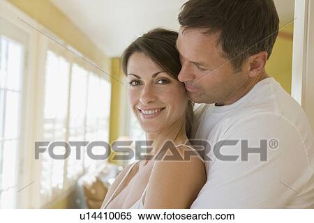 Stock Photography - Couple hugging in the morning. Fotosearch