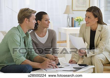 Picture - Couple meeting with financial advisor. Fotosearch