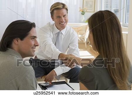 Couple meeting with financial advisor View Large Photo Image Stock Image - Couple meeting with financial advisor. Fotosearch