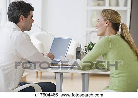 Couple paying bills View Large Photo Image Stock Photograph - Couple paying bills. Fotosearch