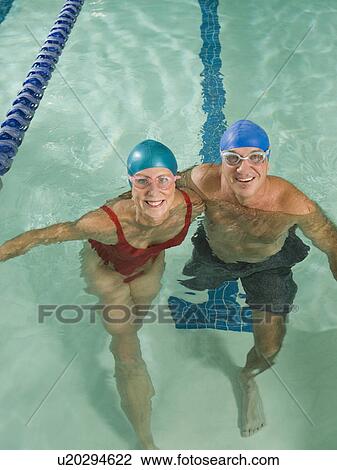 Couple posing in swimming pool View Large Photo Image Stock Image - Couple posing in swimming pool. Fotosearch
