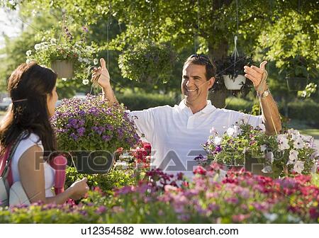 Couple shopping for flowers View Large Photo Image Stock Image - Couple shopping for flowers. Fotosearch