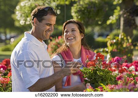Couple shopping for flowers View Large Photo Image Stock Image - Couple shopping for flowers. Fotosearch