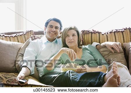 Stock Image - Couple watching television. Fotosearch