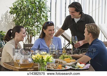 Couples dining on patio View Large Photo Image Stock Photography - Couples dining on patio. Fotosearch