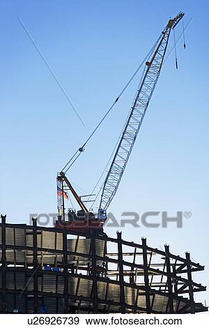 Crane on construction site, New York City, New York, United States View Large Photo Image Stock Photo - Crane on construction site, New York City, New York, United States. Fotosearch