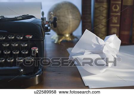 Crumpled paper next to antique typewriter View Large Photo Image Stock Photo - Crumpled paper next to antique typewriter. Fotosearch