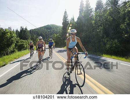 Cyclists on mountain road View Large Photo Image Stock Image - Cyclists on mountain road. Fotosearch