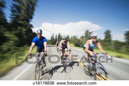 Stock Photo - Cyclists on mountain road. Fotosearch