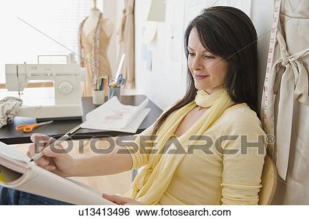 Stock Photograph - Designer working in studio. Fotosearch