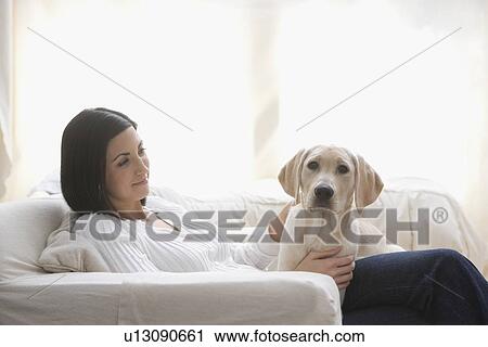 Dog on woman’s lap View Large Photo Image Stock Image - Dog on woman’s lap. Fotosearch