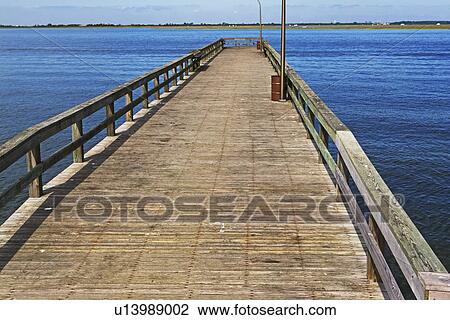 Stock Image - Empty pier at Jones Beach, New York. Fotosearch