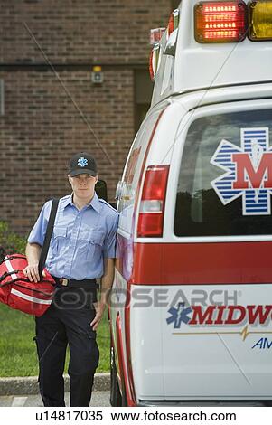 EMT posing in front of ambulance View Large Photo Image Stock Photography - EMT posing in front of ambulance. Fotosearch