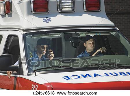 Stock Photo - EMT’s driving in ambulance. Fotosearch
