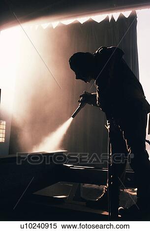 Factory worker sandblasting industrial equipment View Large Photo Image Stock Photography - Factory worker sandblasting industrial equipment. Fotosearch