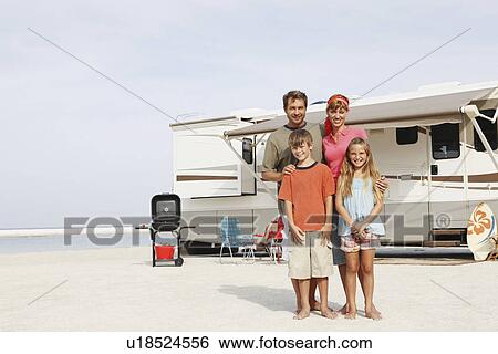 Family posing on beach in front of motor home View Large Photo Image Stock Photograph - Family posing on beach in front of motor home. Fotosearch