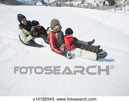 Family riding on sled View Large Photo Image Stock Image - Family riding on sled. Fotosearch