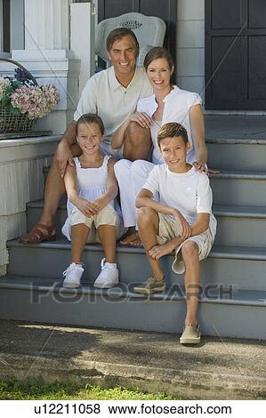 Family sitting on front stoop View Large Photo Image Stock Photo - Family sitting on front stoop. Fotosearch