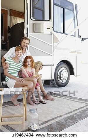 Family sitting on motor home steps View Large Photo Image Picture - Family sitting on motor home steps. Fotosearch