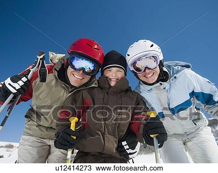 Stock Image - Family wearing ski gear. Fotosearch