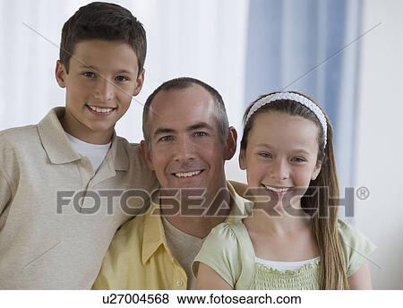 Father and children hugging View Large Photo Image Stock Photo - Father and children hugging. Fotosearch