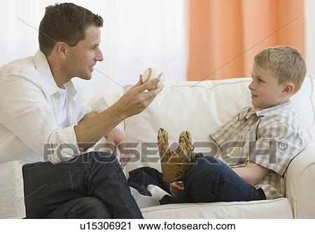 Father and son holding baseball and baseball glove View Large Photo Image Stock Image - Father and son holding baseball and baseball glove. Fotosearch