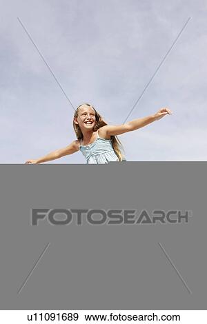 Stock Photo - Father lifting daughter in air. Fotosearch