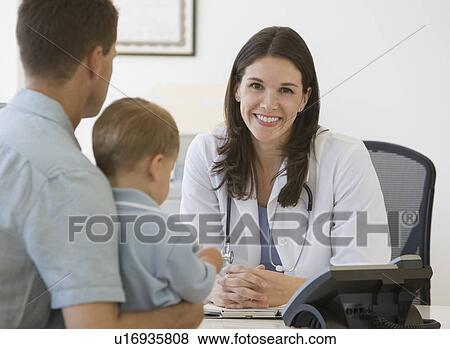 Stock Photo - Female doctor talking to father and son. Fotosearch