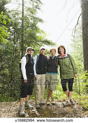 Female hikers posing in forest View Large Photo Image Picture - Female hikers posing in forest. Fotosearch
