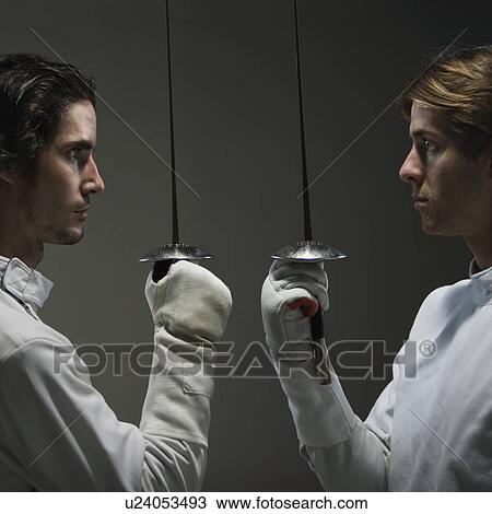 Fencers facing off with fencing foils View Large Photo Image Stock Image - Fencers facing off with fencing foils. Fotosearch